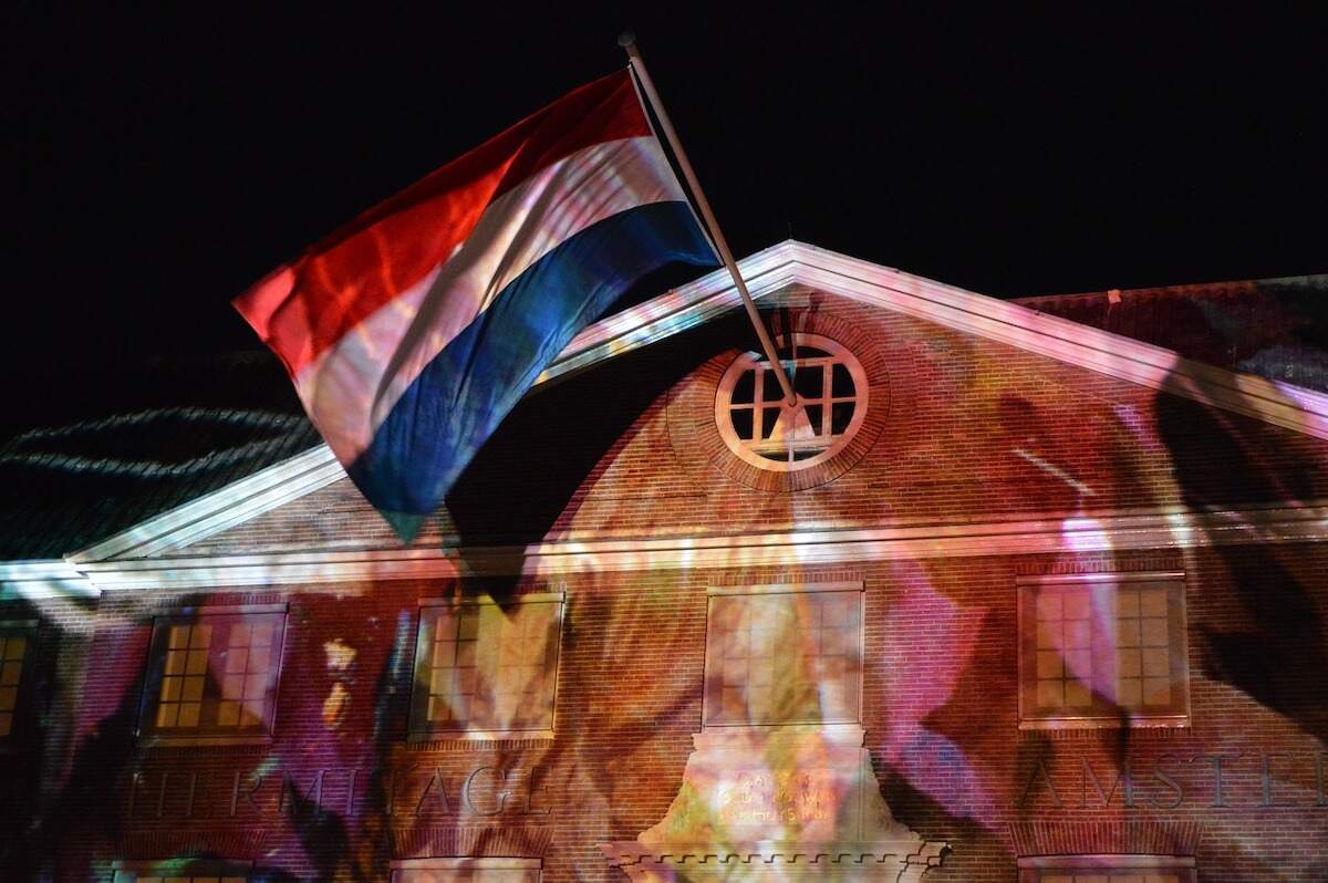 colorful exhibit against a building facade at the free to attend Amsterdam Light Festival