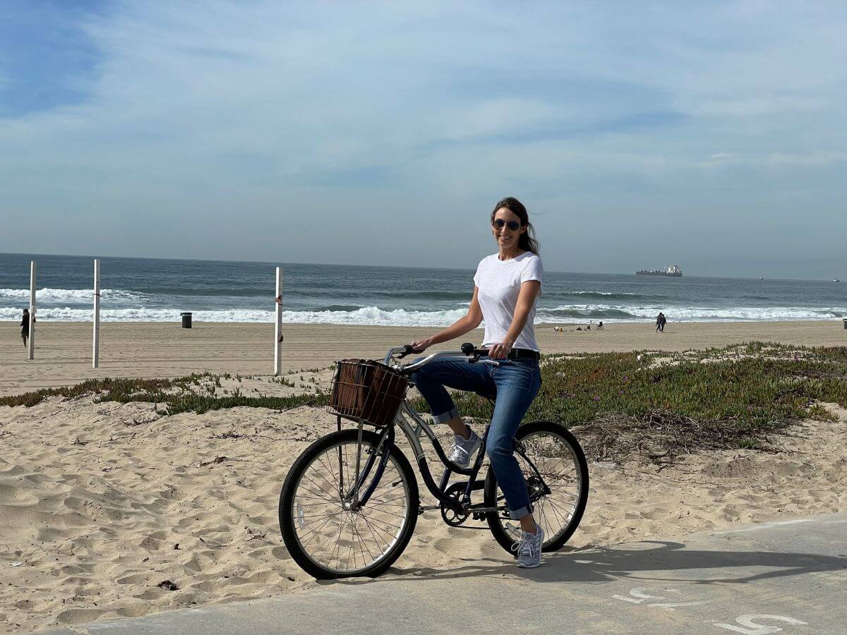 woman cyling The Strand during a 3 day Los Angeles itinerary