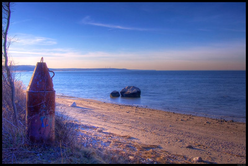 beach with ocean view with buoy in the sand