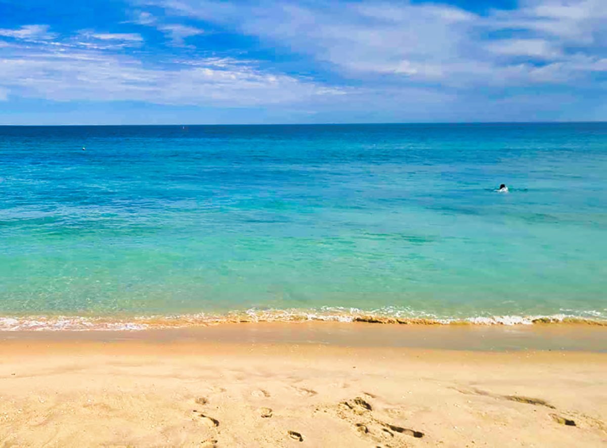 bright turquoise waters lapping up onto the beautiful golden sand of South Beach Fremantle in Australia