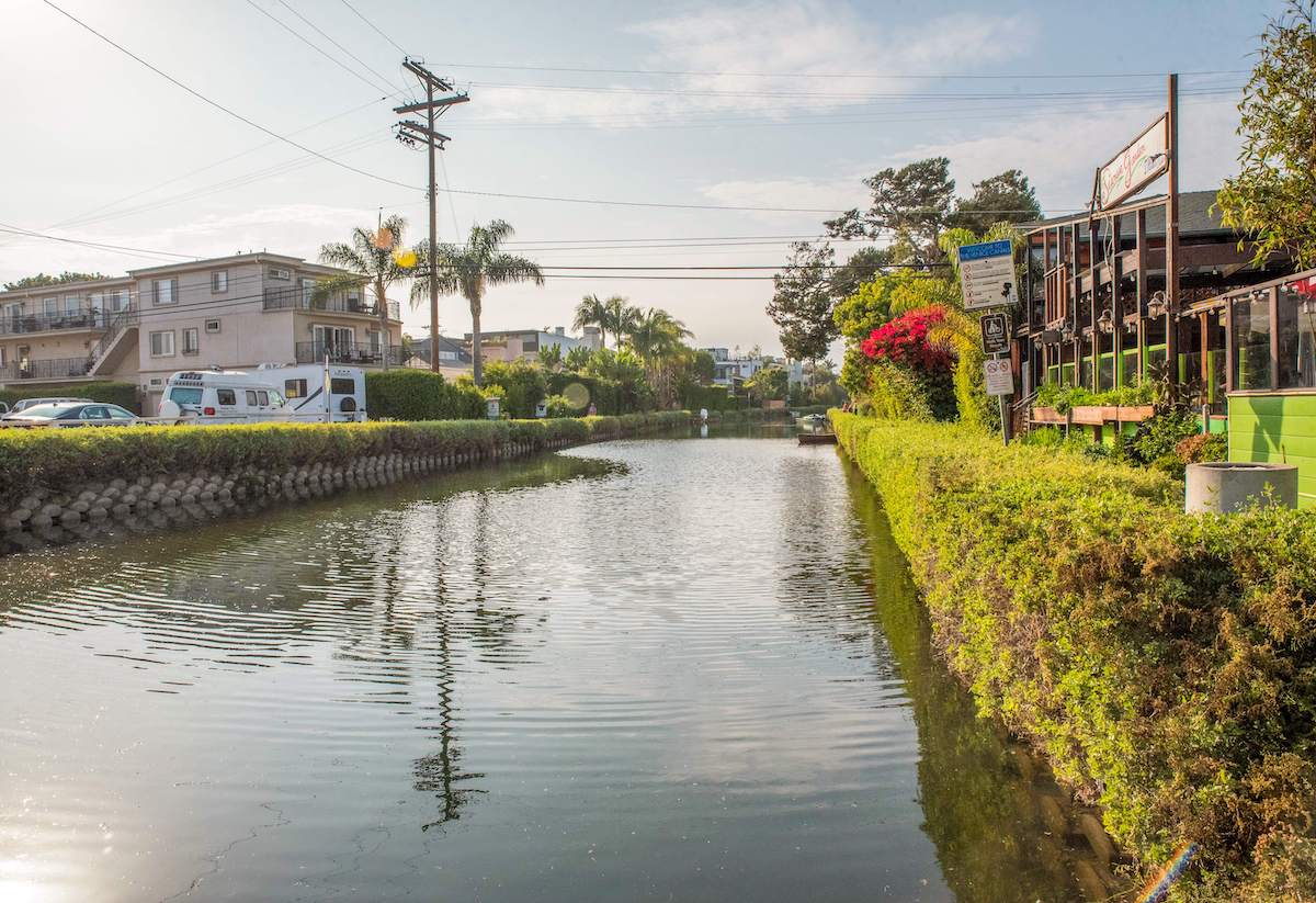 traveler visiting the Venice Canals during a trip to Los Angeles