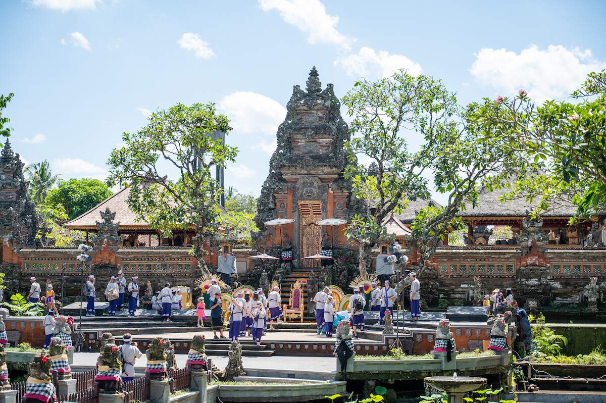 Visitors exploring Saraswati Temple, a popular tourist attraction in Ubud, Bali, known for its beautiful architecture and serene atmosphere, perfect for solo travelers discovering Ubud.